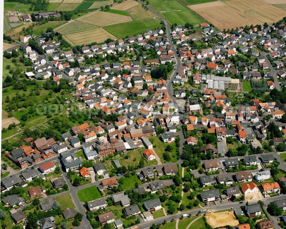 Heuchelheim from the bird's eye view: Residential area - mixed development of a multi-family housing estate and single-family housing estate in Heuchelheim in the state Hesse, Germany