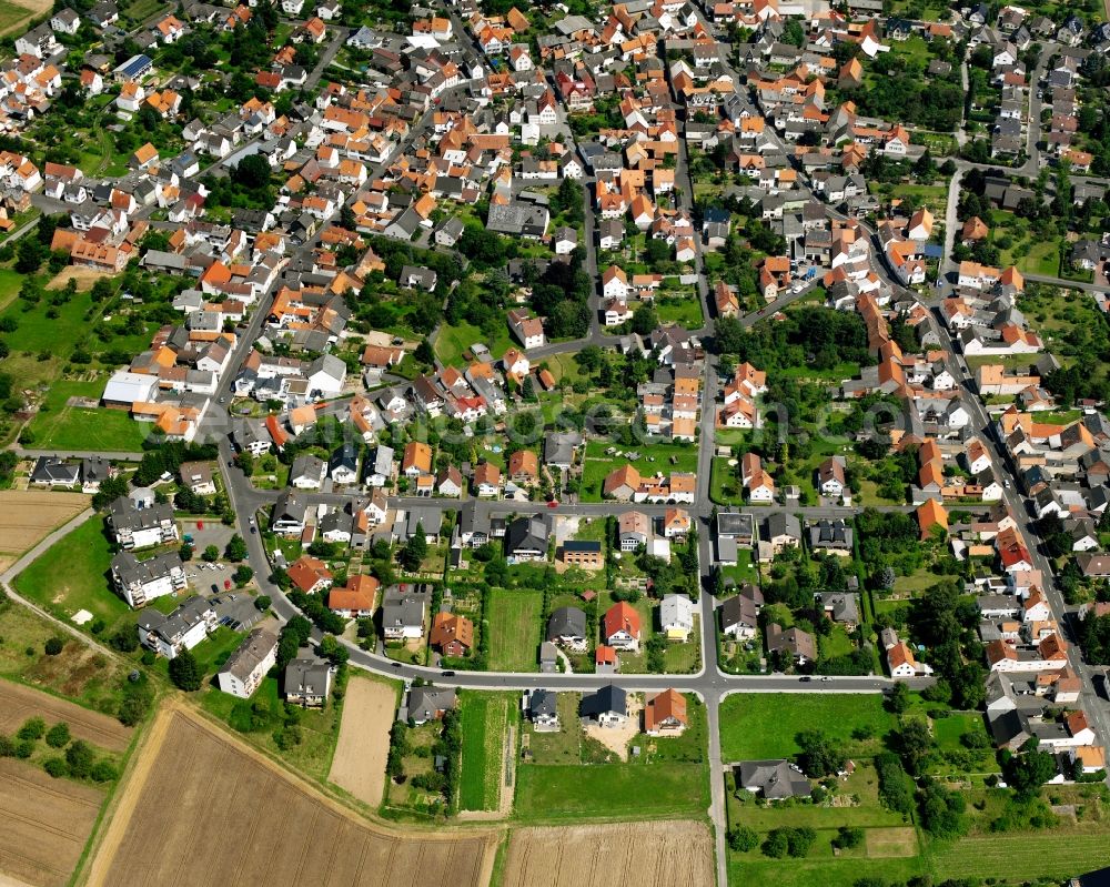 Lützellinden from the bird's eye view: Residential area - mixed development of a multi-family housing estate and single-family housing estate in Lützellinden in the state Hesse, Germany