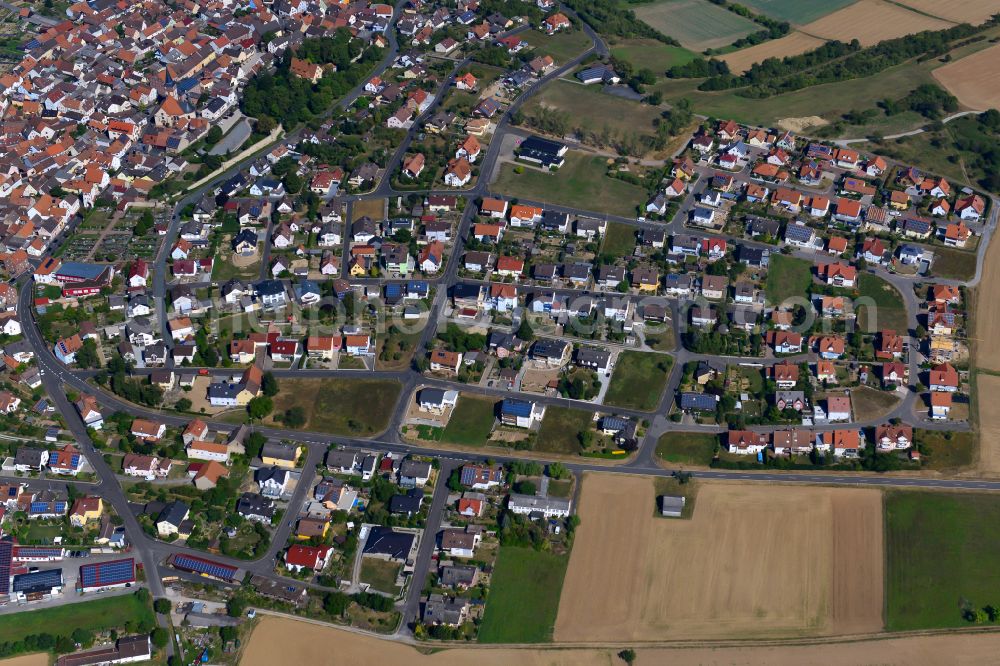 Aerial image Neubrunn - Residential area - mixed development of a multi-family housing estate and single-family housing estate in Neubrunn in the state Bavaria, Germany