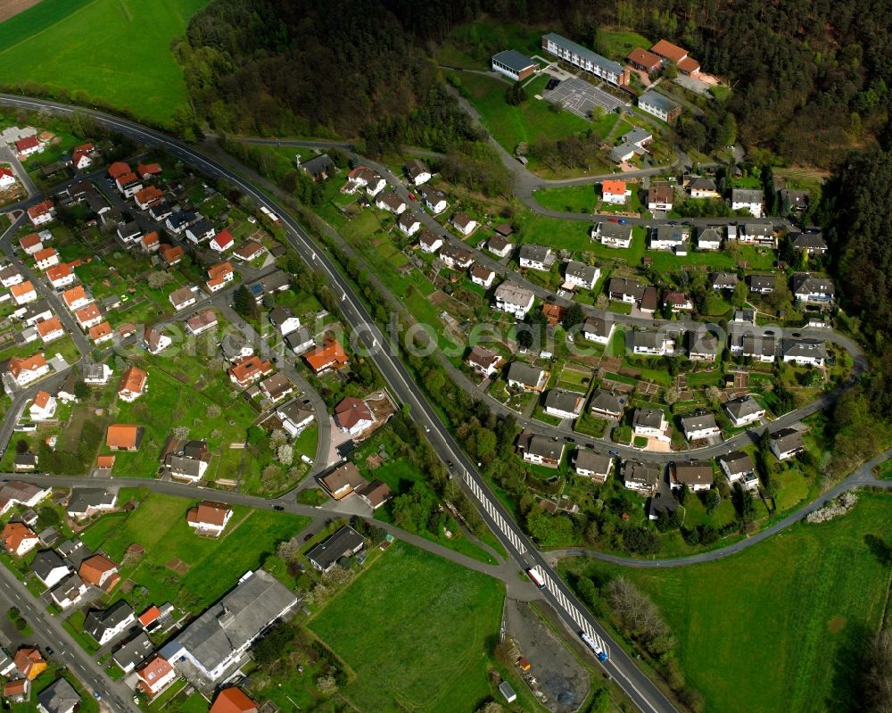 Neukirchen from the bird's eye view: Residential area - mixed development of a multi-family housing estate and single-family housing estate in Neukirchen in the state Hesse, Germany