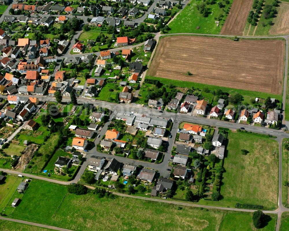 Nieder-Bessingen from above - Residential area - mixed development of a multi-family housing estate and single-family housing estate in Nieder-Bessingen in the state Hesse, Germany