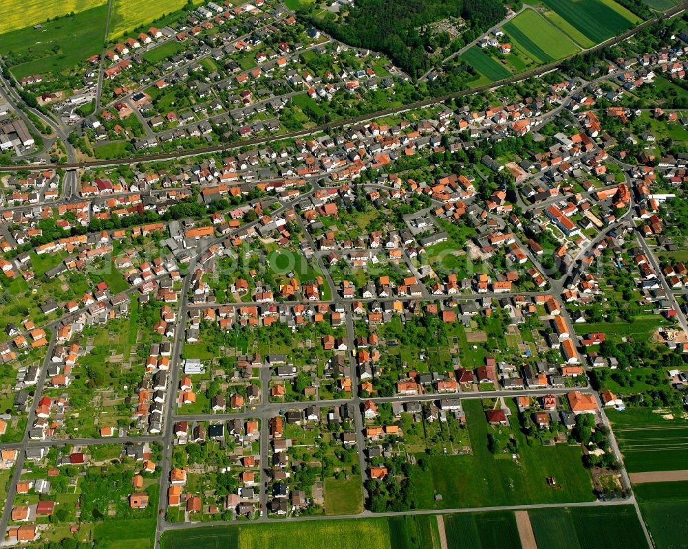 Obersuhl from the bird's eye view: Residential area - mixed development of a multi-family housing estate and single-family housing estate in Obersuhl in the state Hesse, Germany