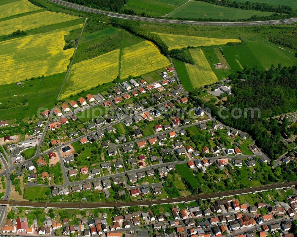 Aerial image Obersuhl - Residential area - mixed development of a multi-family housing estate and single-family housing estate in Obersuhl in the state Hesse, Germany