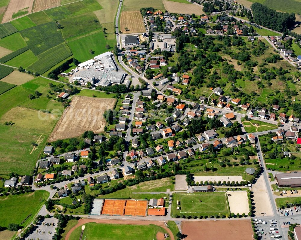 Oberzent from the bird's eye view: Residential area - mixed development of a multi-family housing estate and single-family housing estate in Oberzent in the state Hesse, Germany