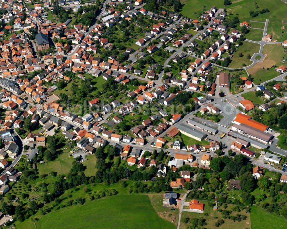 Oberzent from above - Residential area - mixed development of a multi-family housing estate and single-family housing estate in Oberzent in the state Hesse, Germany