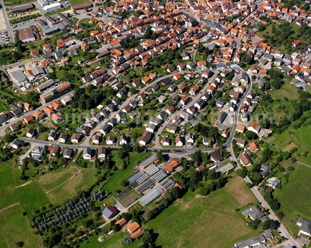 Oberzent from the bird's eye view: Residential area - mixed development of a multi-family housing estate and single-family housing estate in Oberzent in the state Hesse, Germany