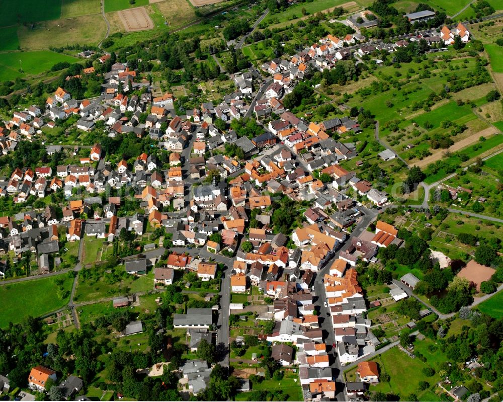 Aerial photograph Rödgen - Residential area - mixed development of a multi-family housing estate and single-family housing estate in Rödgen in the state Hesse, Germany