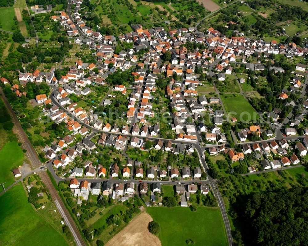 Rödgen from above - Residential area - mixed development of a multi-family housing estate and single-family housing estate in Rödgen in the state Hesse, Germany