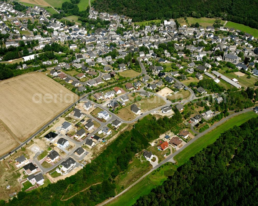 Rhaunen from the bird's eye view: Residential area - mixed development of a multi-family housing estate and single-family housing estate in Rhaunen in the state Rhineland-Palatinate, Germany