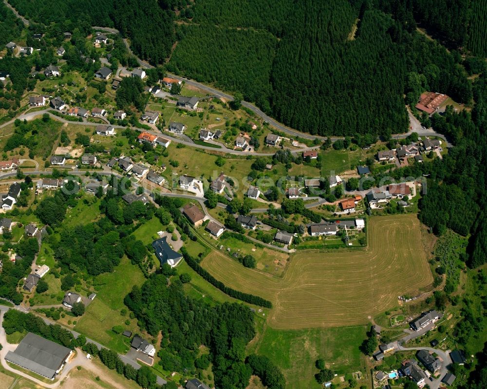 Schwarzenau from the bird's eye view: Residential area - mixed development of a multi-family housing estate and single-family housing estate in Schwarzenau in the state North Rhine-Westphalia, Germany