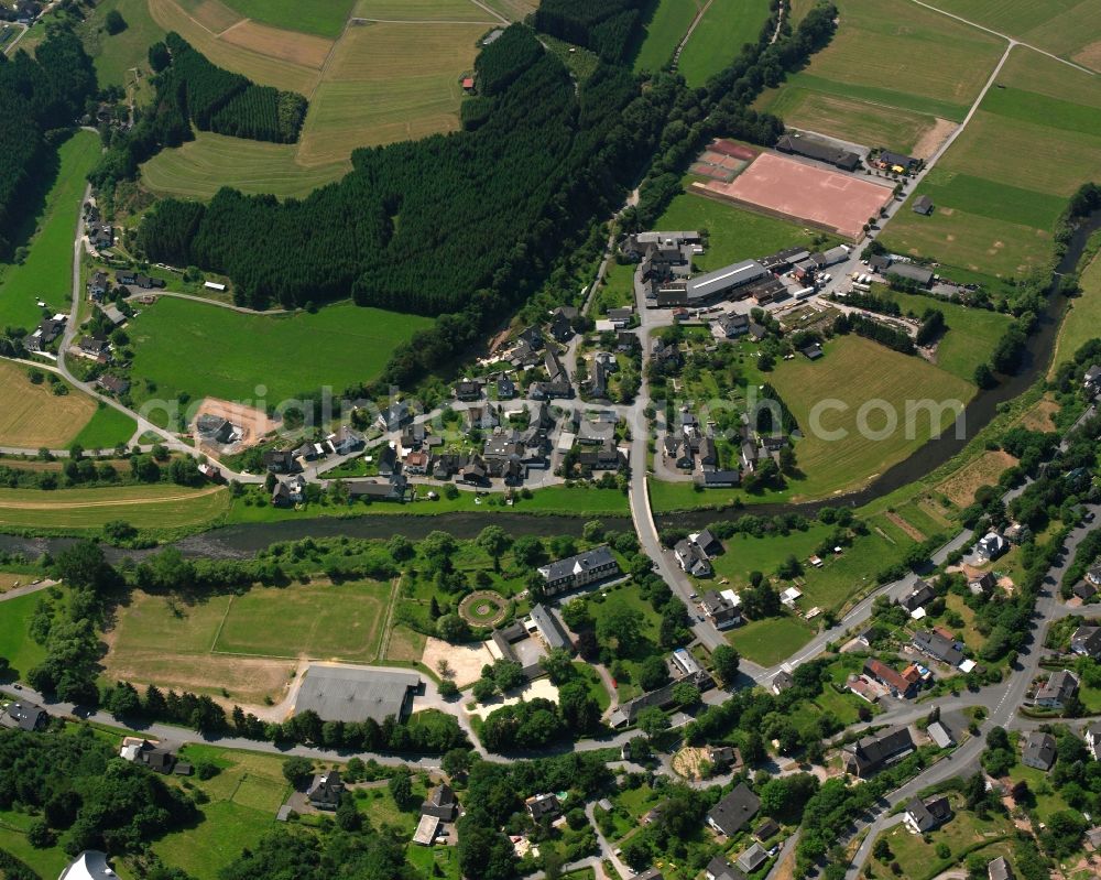 Schwarzenau from the bird's eye view: Residential area - mixed development of a multi-family housing estate and single-family housing estate in Schwarzenau in the state North Rhine-Westphalia, Germany