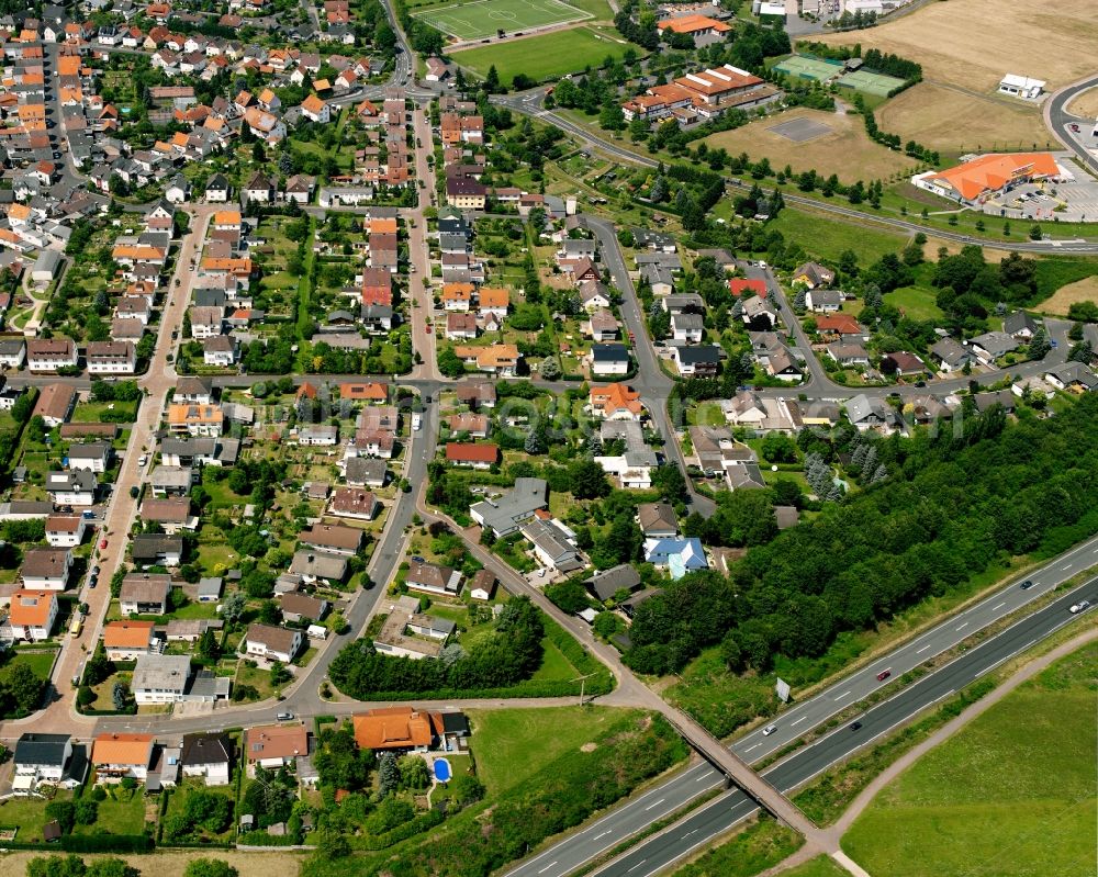 Steinbach from above - Residential area - mixed development of a multi-family housing estate and single-family housing estate in Steinbach in the state Hesse, Germany