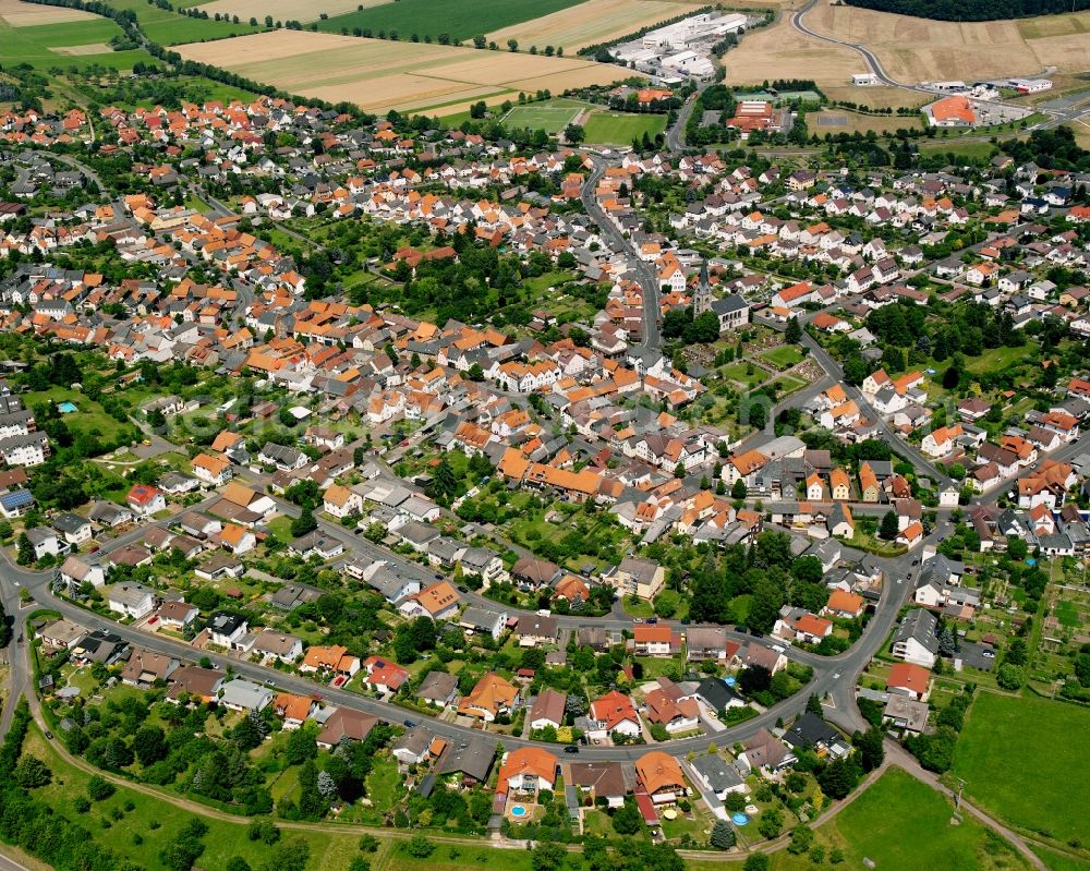 Steinbach from the bird's eye view: Residential area - mixed development of a multi-family housing estate and single-family housing estate in Steinbach in the state Hesse, Germany