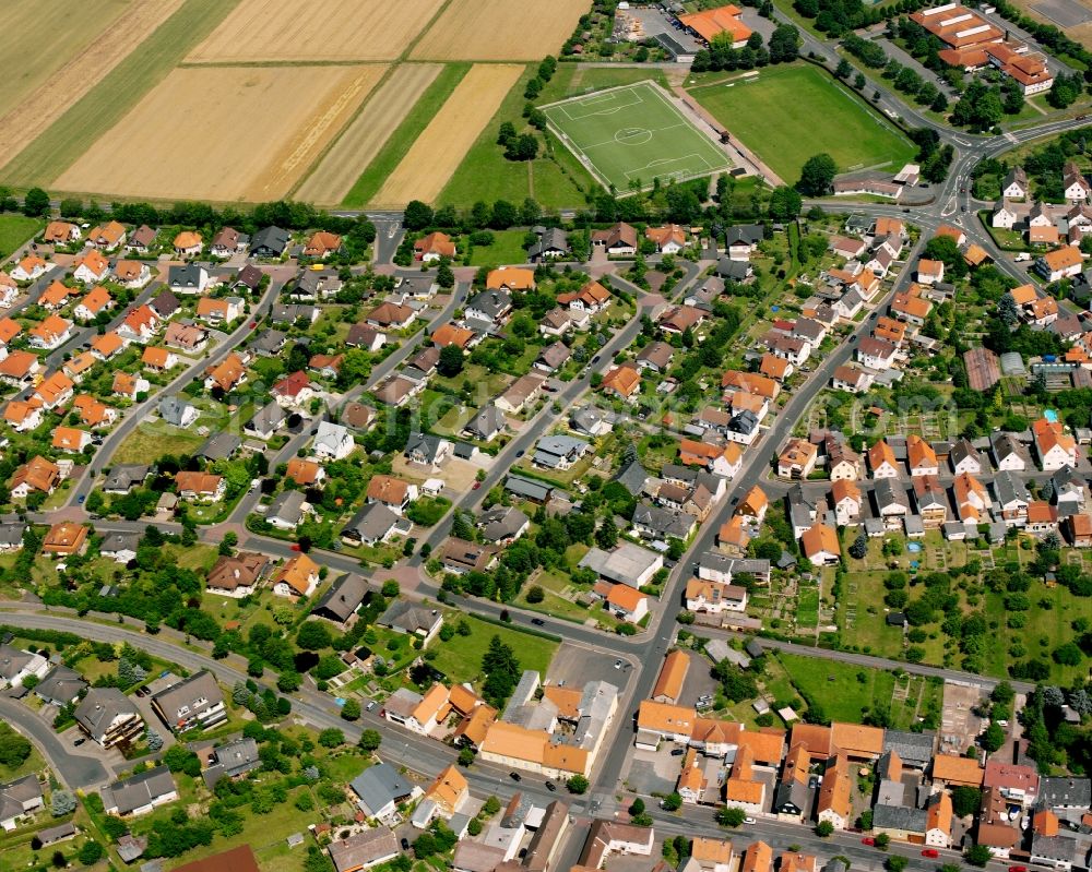 Steinbach from above - Residential area - mixed development of a multi-family housing estate and single-family housing estate in Steinbach in the state Hesse, Germany