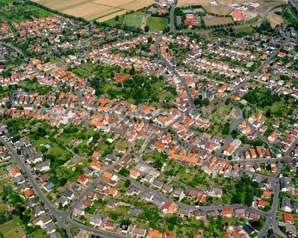 Steinbach from the bird's eye view: Residential area - mixed development of a multi-family housing estate and single-family housing estate in Steinbach in the state Hesse, Germany