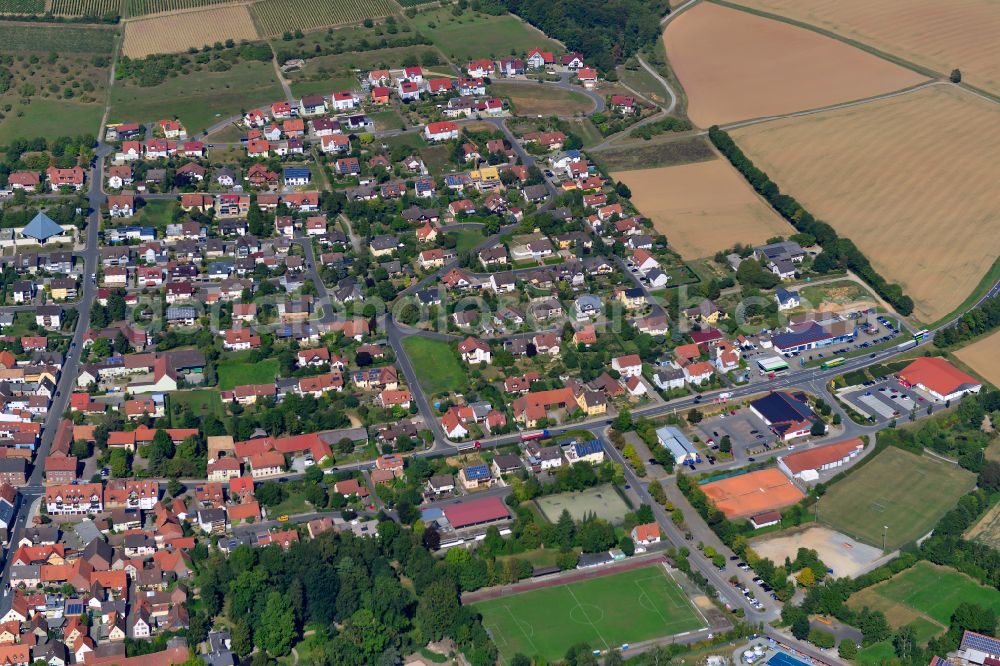 Uettingen from the bird's eye view: Residential area - mixed development of a multi-family housing estate and single-family housing estate in Uettingen in the state Bavaria, Germany