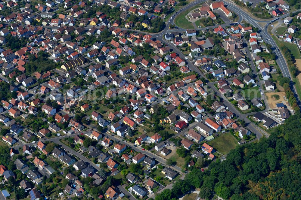 Waldbüttelbrunn from the bird's eye view: Residential area - mixed development of a multi-family housing estate and single-family housing estate in Waldbüttelbrunn in the state Bavaria, Germany