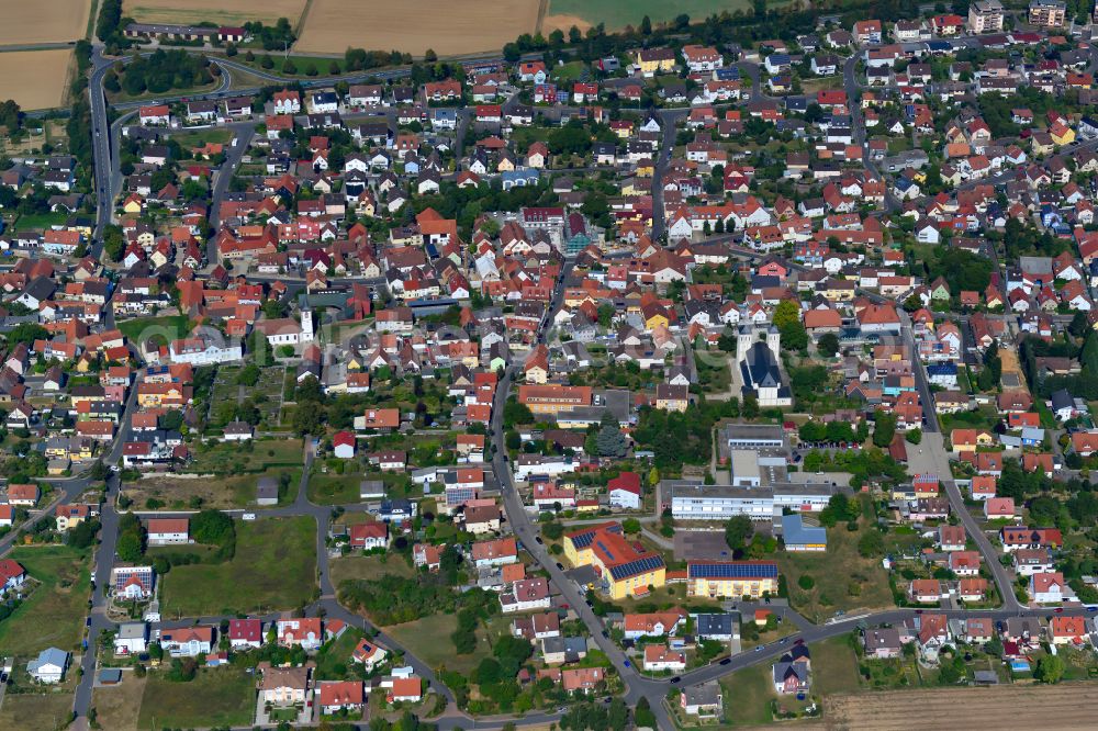 Waldbüttelbrunn from above - Residential area - mixed development of a multi-family housing estate and single-family housing estate in Waldbüttelbrunn in the state Bavaria, Germany