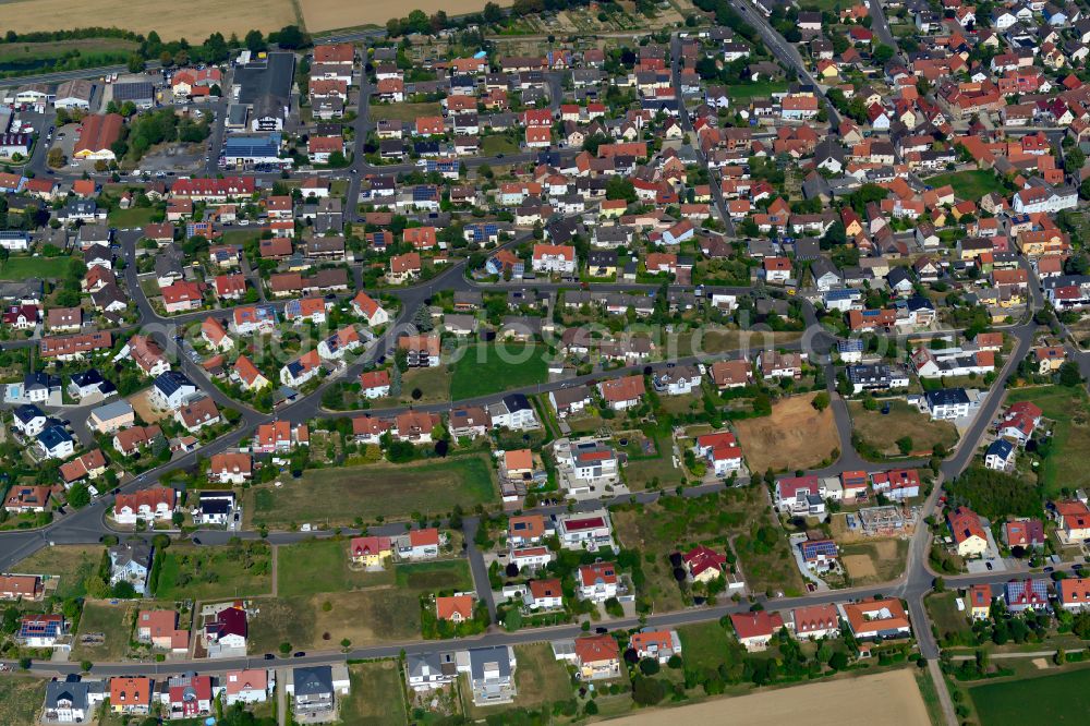 Waldbüttelbrunn from the bird's eye view: Residential area - mixed development of a multi-family housing estate and single-family housing estate in Waldbüttelbrunn in the state Bavaria, Germany