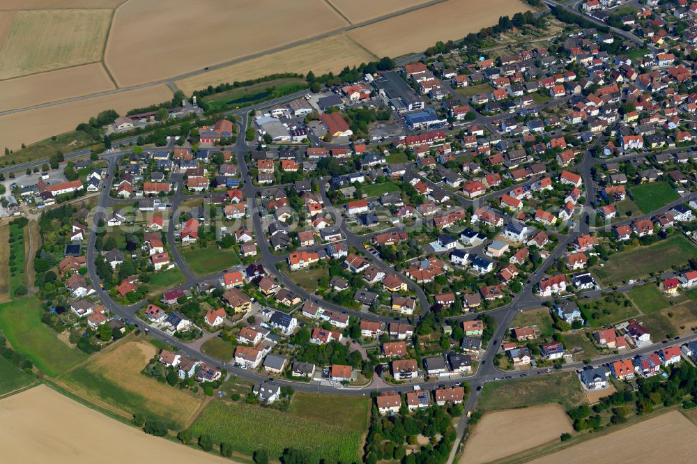 Aerial image Waldbüttelbrunn - Residential area - mixed development of a multi-family housing estate and single-family housing estate in Waldbüttelbrunn in the state Bavaria, Germany