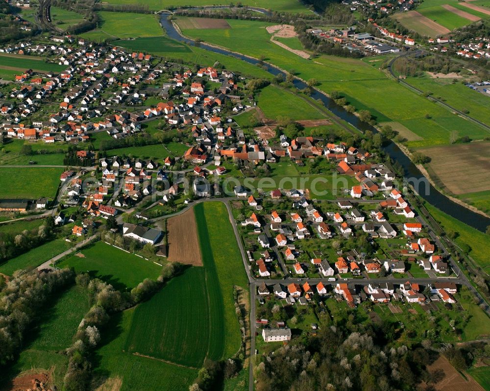 Wölfershausen from the bird's eye view: Residential area - mixed development of a multi-family housing estate and single-family housing estate in Wölfershausen in the state Hesse, Germany