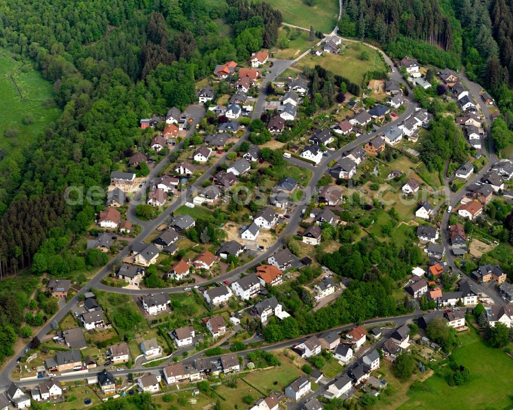 Aerial image Niederfischbach - Residential area in the borough of Niederfischbach in the state of Rhineland-Palatinate. The borough is located in the West of the Giebel Forest and is characterised by agriculture and wooded hills. The creeks Asdorf and Fischbach take their courses through the borough