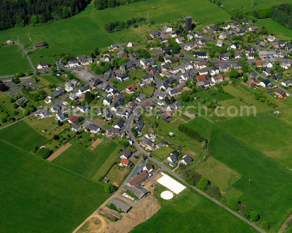 Aerial image Höhn - Residential area in the borough of Hoehn in the state of Rhineland-Palatinate. The borough is located in the county district and region of Westerwald. The residential village is surrounded by fields and meadows. It sits right on federal highway B255 and consists of several parts