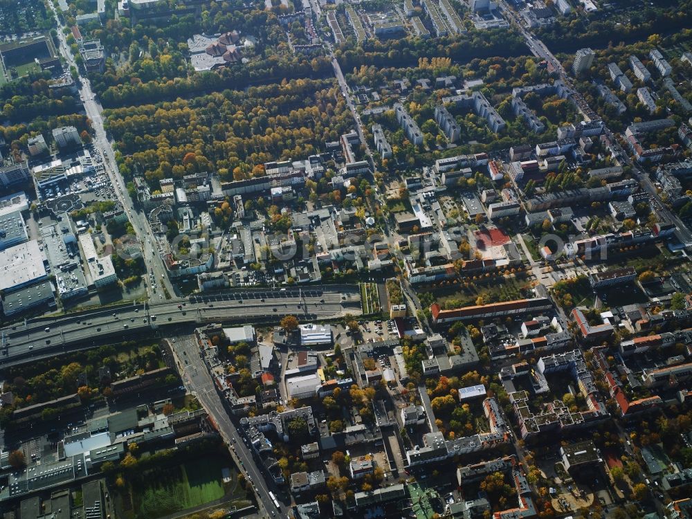 Aerial image Berlin - Residential area with the tunnel exit of federal motorway A100 in the area of Buschkrugallee in the Neukoelln part of Berlin in Germany. An industrial and commercial area is located in the East of the area. Teltow canal takes its course in the South of the area