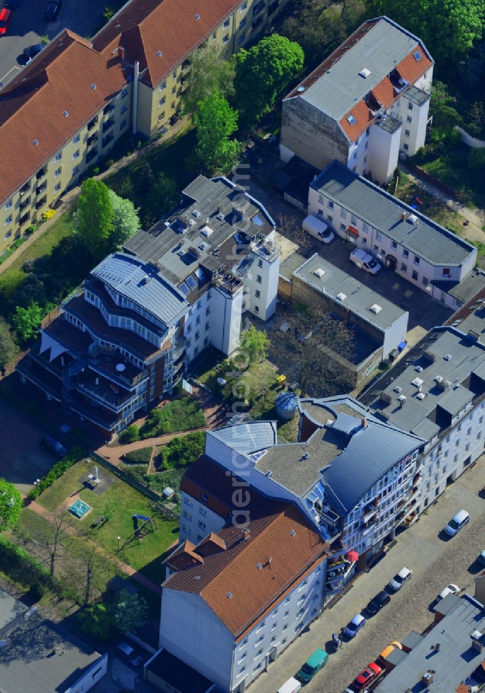 Berlin from above - Residential area on Parrisius Street in the Koepenick part of the district of Treptow-Koepenick in Berlin. The residential area consists of semi-detached houses, estates and newly built multi-family buildings with terraces and distinct architecture