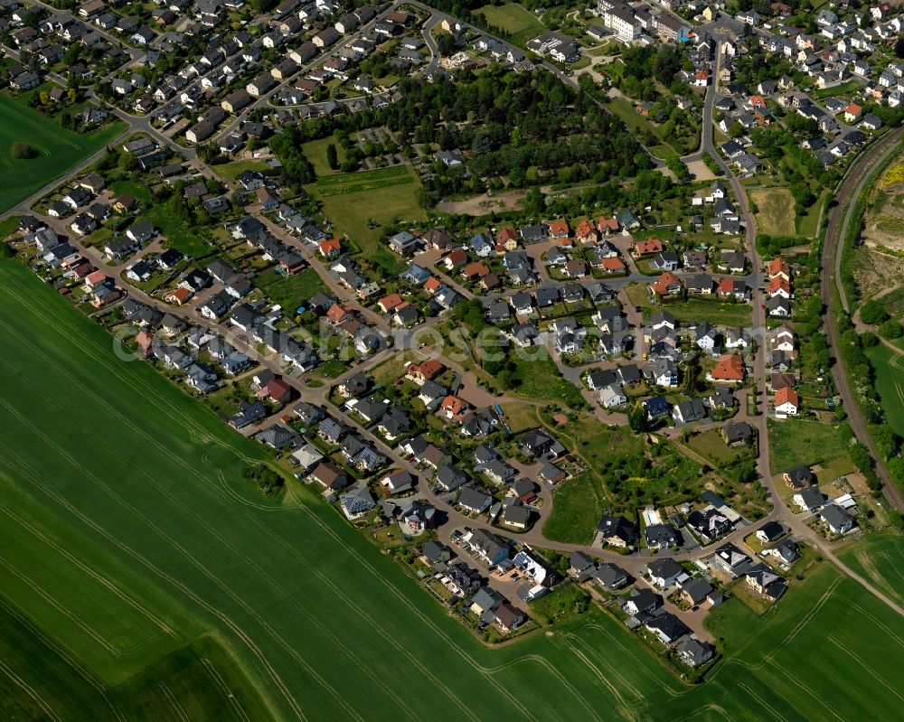 Mendig from above - Residential areas on the edge of the Niedermendig part of Mendig in the state Rhineland-Palatinate. The town is located in the county district of Mayen-Koblenz in the Eastern Eifel region. It is known as a town of breweries and lava cellars - from volcanic origin. Mendig consists of two parts. Several residential areas with single family houses are located on the edge of Niedermendig