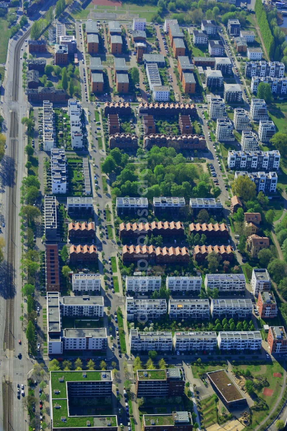 Berlin from above - Residential area with semi-detached houses in the Rummelsburg part of the district of Lichtenberg in Berlin in Germany. The buildings are located on An der Bucht-Street near the northern shores of the lake Rummelsberger See. View from the West towards the park and square Medaillonplatz