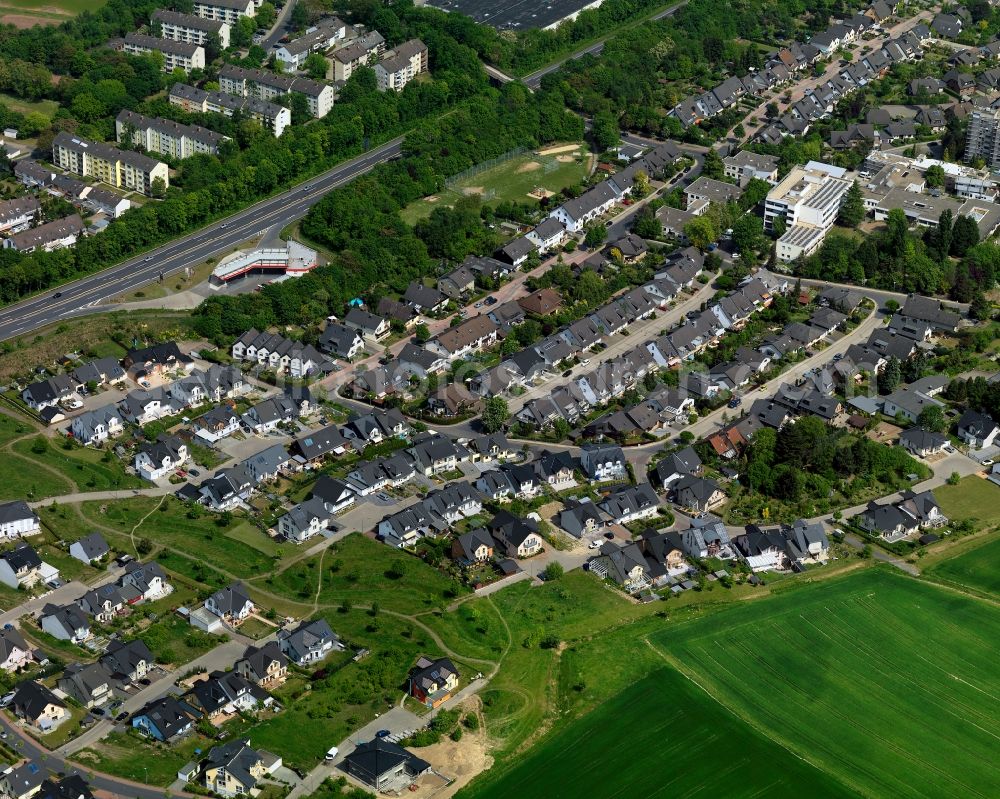 Andernach from above - Residential area in the South of Andernach in the state of Rhineland-Palatinate. The town is located in the county district of Mayen-Koblenz on the left riverbank of the river Rhine. The town is characterised by industry, consists of five boroughs and districts and belongs to the oldest towns in Germany. A residential area with single family houses, gardens and allotments is located in the South of Andernach along a field