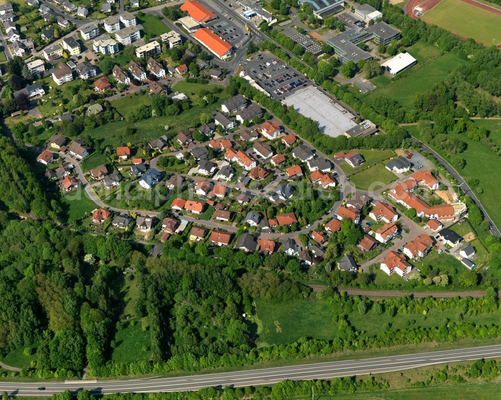 Westerburg from above - Residential area in the South of Westerburg in Rhineland-Palatinate. Westerburg is an official tourist resort in the county district of Westerwald. The centre of the town is located in the valley of Schafbach creek. A residence for the eldery is located next to the residential area