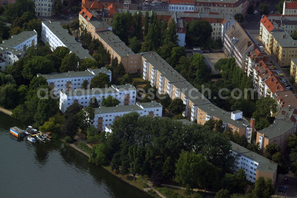 Berlin from above - Residential area on the Southern riverbank of the river Spree in the Niederschoeneweide part of the district of Treptow-Koepenick in Berlin in Germany. The area with the trees and residential estates is located on Hainstrasse