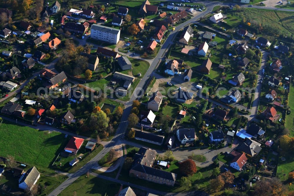 Sponholz from the bird's eye view: Residential area with single-family homes, farmhouse and church in the district Warlin. The area lies at the Anklamer Straße in Sponholz in the state of Mecklenburg-Western Pomerania