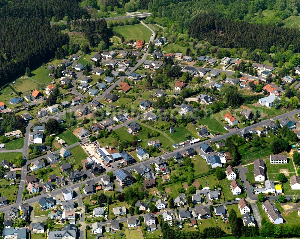 Aerial photograph Rennerod - Residential area in the town of Rennerod in the state of Rhineland-Palatinate. The town is located in the Westerwald region and county district on federal highway B54. It is surrounded by industrial areas, agricultural fields and meadows