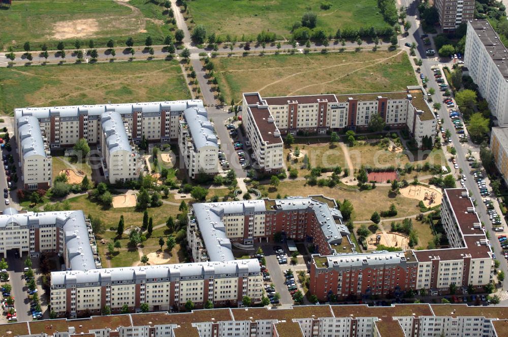 Aerial photograph Berlin - Blick auf das Wohngebiet Weiße Taube in Berlin Hohenschönhausen. Die Wohnhäuser entstanden auf dem Gelände einer ehemaligen Gärtnerei in raumklimatisch gesunder Ziegelbauweise. Ebenfalls entstanden Kindertagesstätten, sowie Geschäfte, Arztpraxen, Büros und gastronomische Betriebe. Kontakt Vermietung: KCC Max Aicher Objekt Berlin GmbH & Co. KG, Vermietungsbüro: Schalkauer Straße 29, 13055 Berlin, Tel. +49(0)30 98608730; Kontakt Aicher: Ma Aicher GmbH & Co. KG, Teisenbergstraße 7, 83395 Freilassing, Tel. +49(0)8654 491 0, Fax +49(0)8654 491 210, Email: immobilien@max-aicher.de