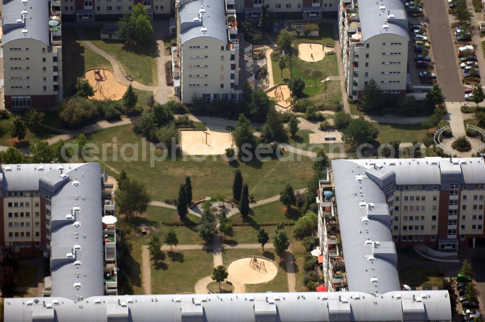 Berlin from the bird's eye view: Blick auf das Wohngebiet Weiße Taube an der Landsberger Allee / Schalkauer Strasse in Berlin - Hohenschönhausen.Auf dem Gelände einer ehemaligen Gärtnerei entstanden in raumklimatisch gesunder Ziegelbauweise geförderte 1,5 bis 4-Zimmerwohnungen von ca. 50 bis über 100 m², zwei Kindertagesstätten, Räumlichkeiten für eine gemischte gewerbliche Struktur: Geschäfte, Arztpraxen, Büros und gastronomische Betriebe - rundum ein umfassendes Güter- und Dienstleistungsangebot in einem weitgehen?????????????????????????????????????????????????????????????????????????????????????????????????????????????????????????????????????????????????????????????????????????????????????????