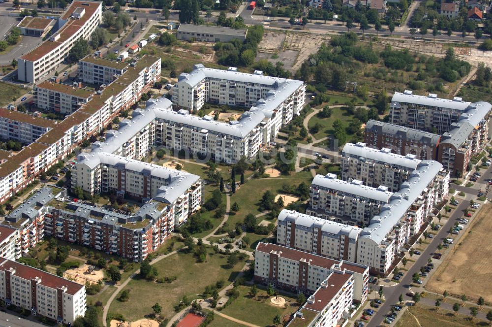 Aerial photograph Berlin - Blick auf das Wohngebiet Weiße Taube an der Landsberger Allee / Schalkauer Strasse in Berlin - Hohenschönhausen.Auf dem Gelände einer ehemaligen Gärtnerei entstanden in raumklimatisch gesunder Ziegelbauweise geförderte 1,5 bis 4-Zimmerwohnungen von ca. 50 bis über 100 m², zwei Kindertagesstätten, Räumlichkeiten für eine gemischte gewerbliche Struktur: Geschäfte, Arztpraxen, Büros und gastronomische Betriebe - rundum ein umfassendes Güter- und Dienstleistungsangebot in einem weitgehen?????????????????????????????????????????????????????????????????????????????????????????????????????????????????????????????????????????????????????????????????????????????????????????