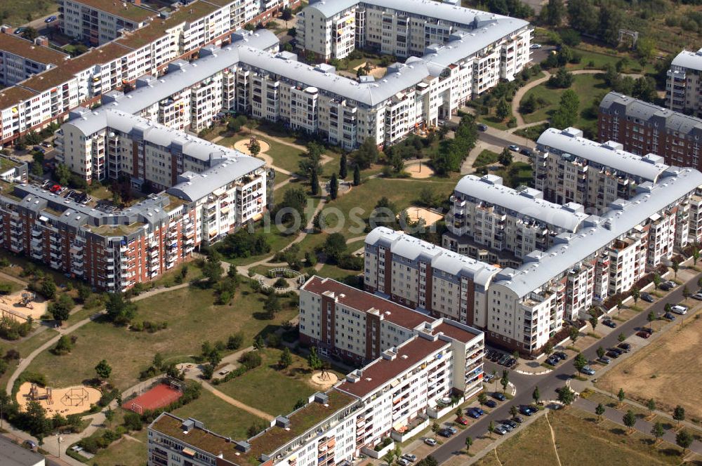 Berlin from the bird's eye view: Blick auf das Wohngebiet Weiße Taube an der Landsberger Allee / Schalkauer Strasse in Berlin - Hohenschönhausen.Auf dem Gelände einer ehemaligen Gärtnerei entstanden in raumklimatisch gesunder Ziegelbauweise geförderte 1,5 bis 4-Zimmerwohnungen von ca. 50 bis über 100 m², zwei Kindertagesstätten, Räumlichkeiten für eine gemischte gewerbliche Struktur: Geschäfte, Arztpraxen, Büros und gastronomische Betriebe - rundum ein umfassendes Güter- und Dienstleistungsangebot in einem weitgehen?????????????????????????????????????????????????????????????????????????????????????????????????????????????????????????????????????????????????????????????????????????????????????????