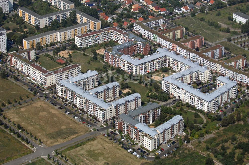 Berlin from the bird's eye view: Blick auf das Wohngebiet Weiße Taube an der Landsberger Allee / Schalkauer Strasse in Berlin - Hohenschönhausen.Auf dem Gelände einer ehemaligen Gärtnerei entstanden in raumklimatisch gesunder Ziegelbauweise geförderte 1,5 bis 4-Zimmerwohnungen von ca. 50 bis über 100 m², zwei Kindertagesstätten, Räumlichkeiten für eine gemischte gewerbliche Struktur: Geschäfte, Arztpraxen, Büros und gastronomische Betriebe - rundum ein umfassendes Güter- und Dienstleistungsangebot in einem weitgehen?????????????????????????????????????????????????????????????????????????????????????????????????????????????????????????????????????????????????????????????????????????????????????????