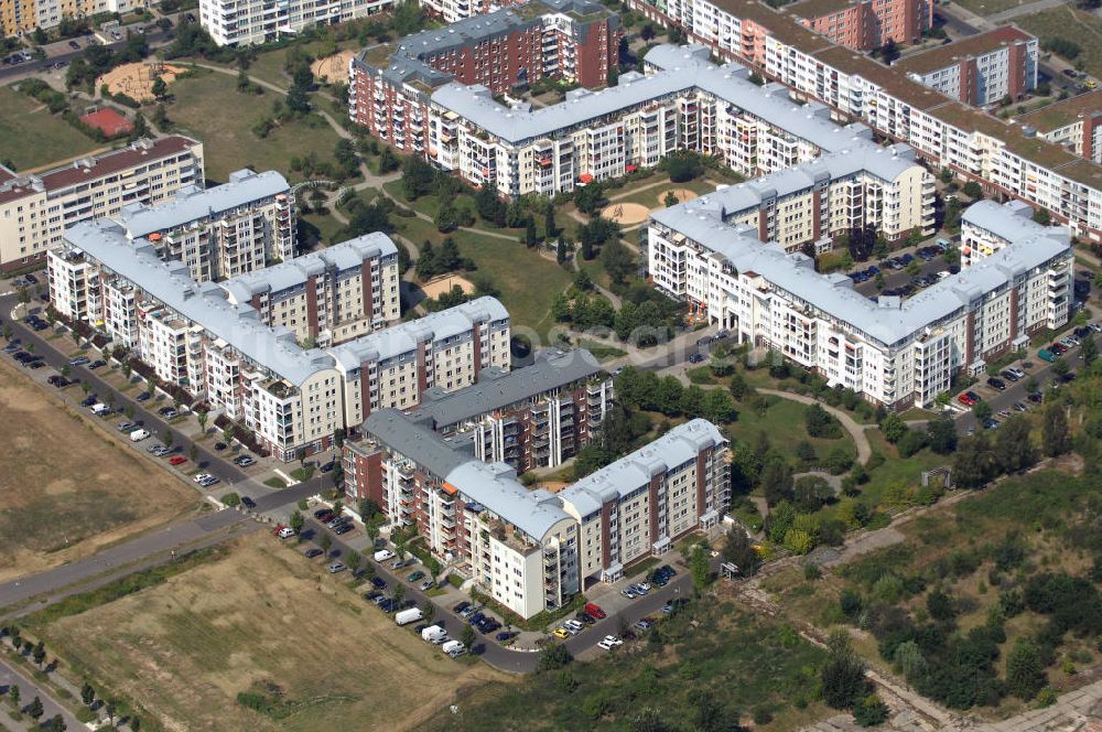 Aerial image Berlin - Blick auf das Wohngebiet Weiße Taube an der Landsberger Allee / Schalkauer Strasse in Berlin - Hohenschönhausen.Auf dem Gelände einer ehemaligen Gärtnerei entstanden in raumklimatisch gesunder Ziegelbauweise geförderte 1,5 bis 4-Zimmerwohnungen von ca. 50 bis über 100 m², zwei Kindertagesstätten, Räumlichkeiten für eine gemischte gewerbliche Struktur: Geschäfte, Arztpraxen, Büros und gastronomische Betriebe - rundum ein umfassendes Güter- und Dienstleistungsangebot in einem weitgehen?????????????????????????????????????????????????????????????????????????????????????????????????????????????????????????????????????????????????????????????????????????????????????????