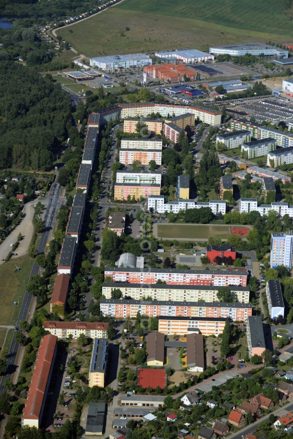 Waren (Müritz) from the bird's eye view: Residential area in the West of Waren (Mueritz) in the state of Mecklenburg - Western Pomerania. The area with its multi-family houses and residential estates is located along Roebeler Chaussee. A commercial area with shopping facilities borders the area in the West