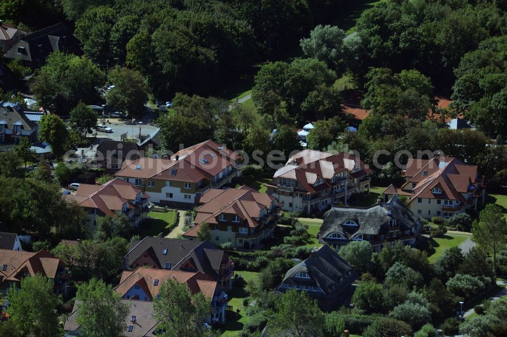 Aerial image Wustrow - Residential area in Wustrow in the state of Mecklenburg - Western Pomerania. The area includes residential homes, single family houses, hotels and holiday apartments and is located in the West of the village, surrounded by trees and forest