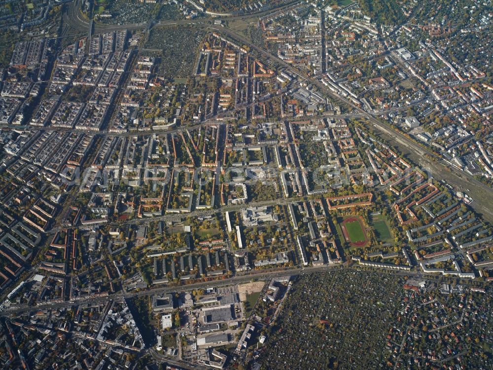 Aerial photograph Berlin - View of the residential area between Bornholmer Strasse, Prenzlauer Promenade and S-Bahn tracks in the Pankow district of Berlin. Bornholmer Strasse (on the left image edge) is an important street in the South of the districts of Pankow and Reinickendorf. Prenzlauer Allee takes its course in the East of the area, the overground and underground station Pankow is located in the North