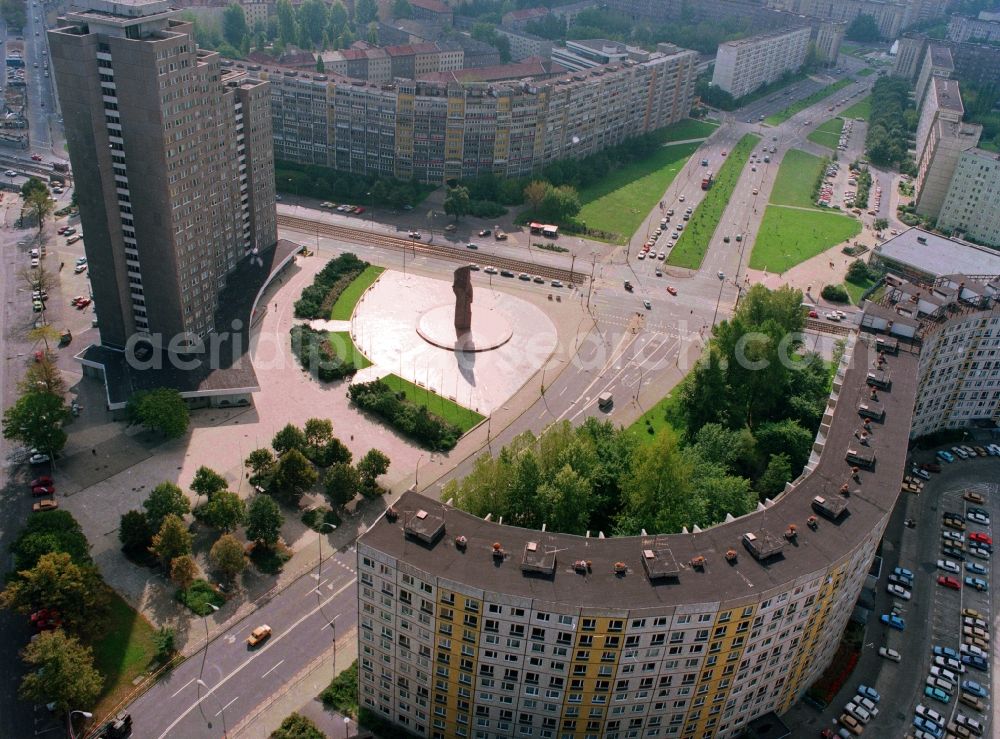 Berlin from above - View at the stone figure of the revolutionary Lenin, who is since April 1970 as a monument to Lenin Square (now the United Nations Square) in Berlin Friedrichshain. On the left the tower high-rise, one of the tallest residential buildings in East Berlin