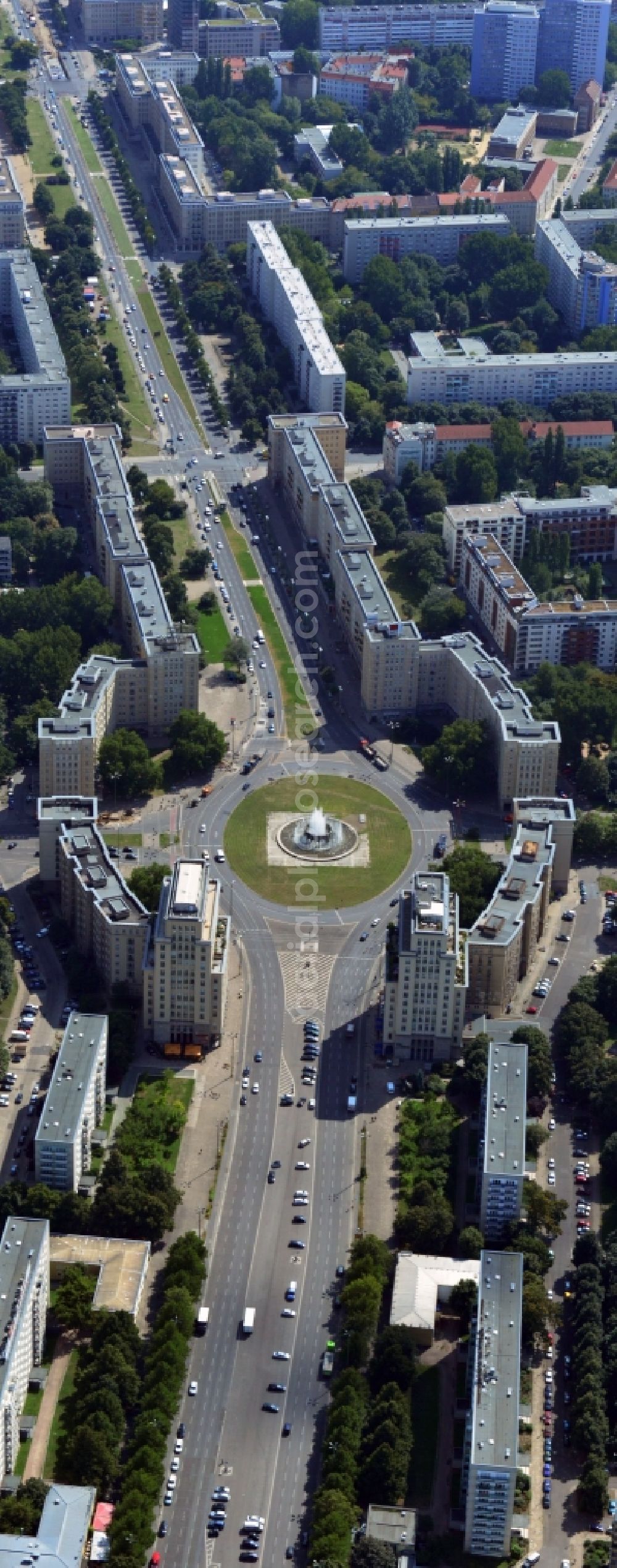 Berlin-Friedrichshain from above - View of the Strausberger Platz with fountain in the district Friedrichshain of Berlin. The Strausberger Platz marks the border to the borough Mitte. The place was arranged 1967 after a fountain, designed by Fritz Kühn, had been constructed