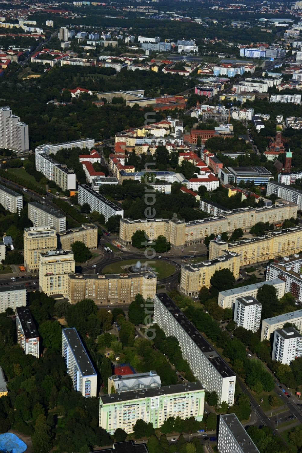 Berlin Friedrichshain from the bird's eye view: View of the Strausberger Platz with fountain in the district Friedrichshain of Berlin. The Strausberger Platz marks the border to the borough Mitte. The place was arranged 1967 after a fountain, designed by Fritz Kühn, had been constructed