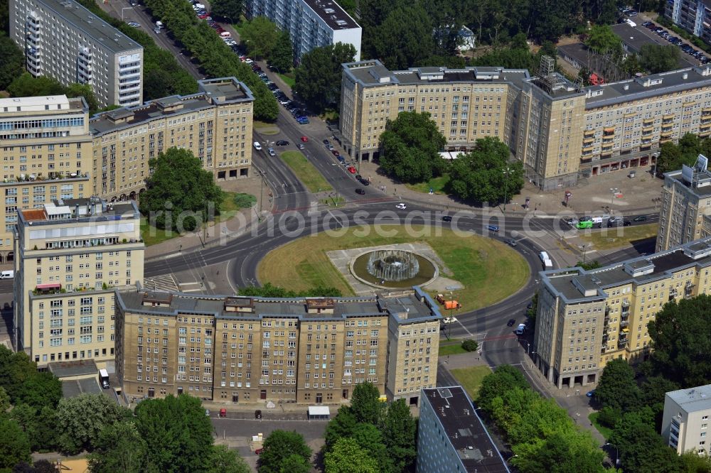 Berlin Friedrichshain from above - View of the Strausberger Platz with fountain in the district Friedrichshain of Berlin. The Strausberger Platz marks the border to the borough Mitte. The place was arranged 1967 after a fountain, designed by Fritz Kühn, had been constructed