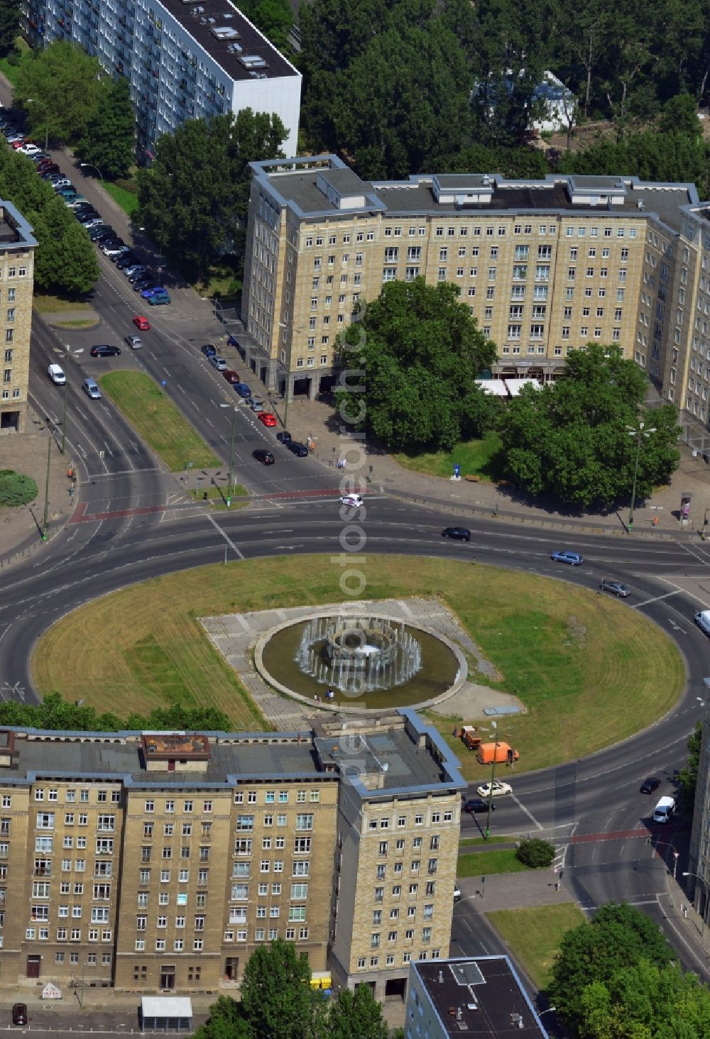 Berlin Friedrichshain from the bird's eye view: View of the Strausberger Platz with fountain in the district Friedrichshain of Berlin. The Strausberger Platz marks the border to the borough Mitte. The place was arranged 1967 after a fountain, designed by Fritz Kühn, had been constructed